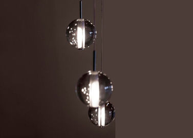 Le lustre en cristal transparent allume l'éclairage pendant mené de boule en verre
